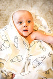 a baby wrapped up with  Muslin Swaddle Blanket